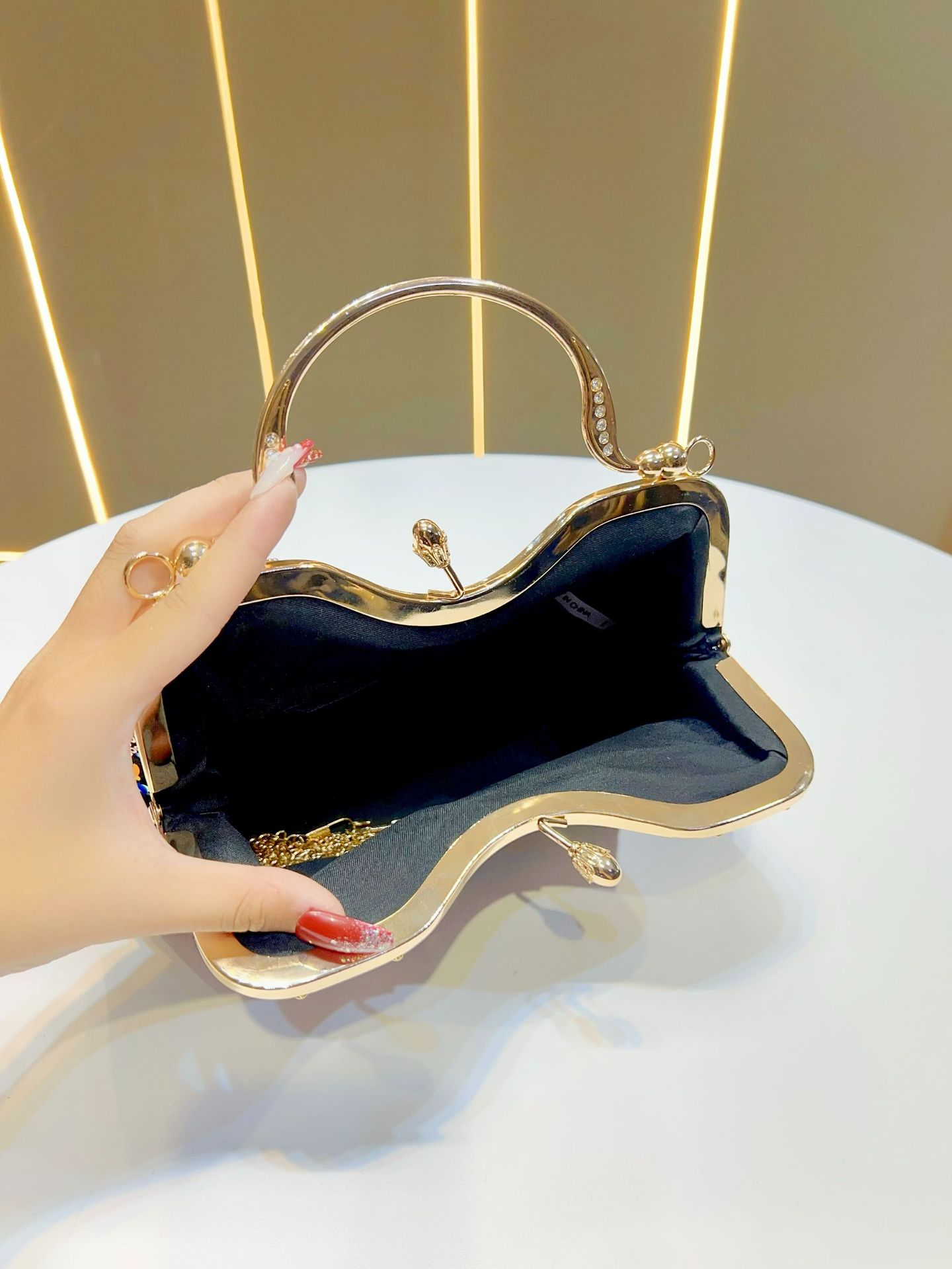 Pleated Clutch Bag with Chain Strap and Top Handle Design